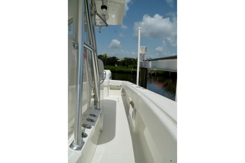 Slide: The Image of 2017 SeaVee 34Z boat deck with stainless steel railings, under a clear blue sky. - 50