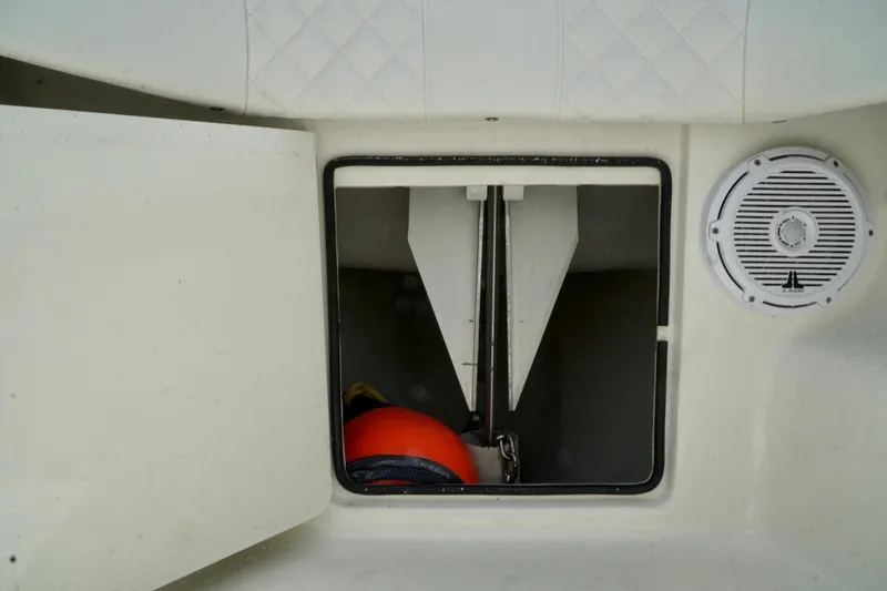 Slide: The Image of Storage compartment on 2017 SeaVee 34Z boat with speaker and safety equipment. - 53