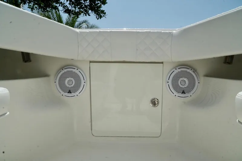 Slide: The Image of 2017 SeaVee 34Z boat interior with speakers and storage compartment. - 55