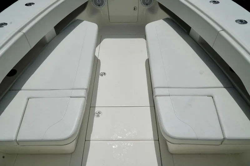 Slide: The Image of 2017 SeaVee 34Z boat interior with white cushioned seating and sleek design. - 56