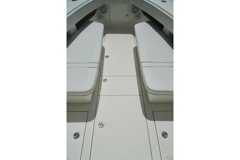 Slide: The Image of 2017 SeaVee 34Z boat interior with cushioned seating and storage compartments. - 62