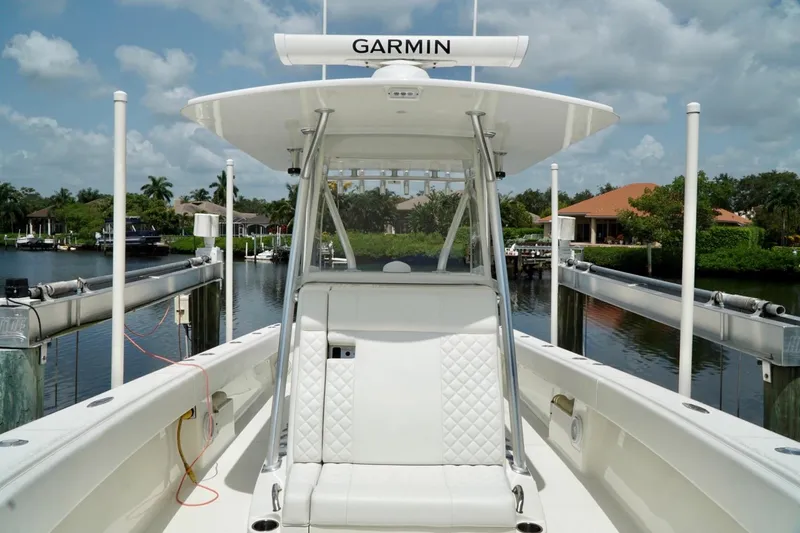 Slide: The Image of 2017 SeaVee 34Z boat with Garmin equipment, docked in a scenic waterfront setting. - 63
