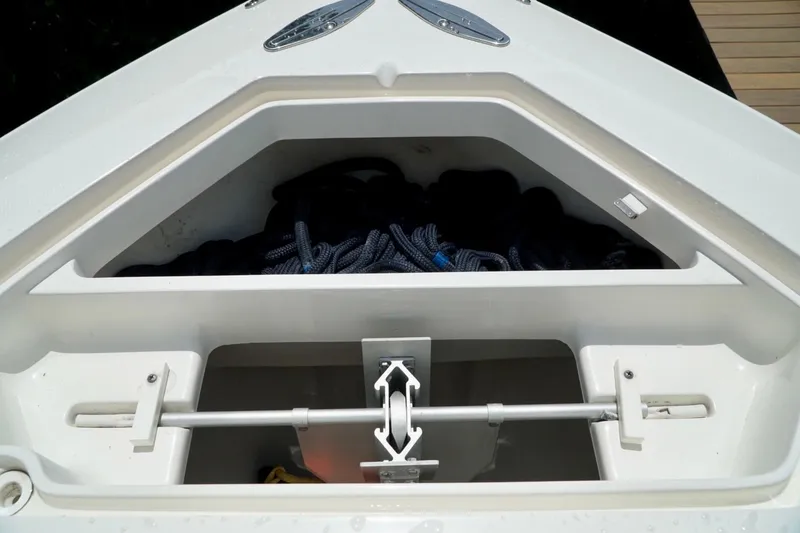Slide: The Image of Anchor storage compartment on 2017 SeaVee 34Z boat, featuring ropes and anchor mechanism. - 68