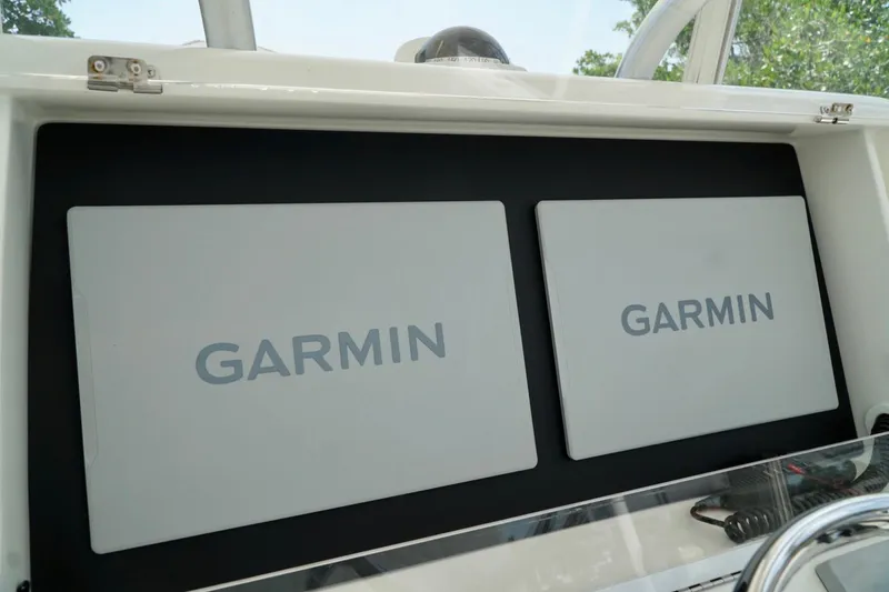 Slide: The Image of Dual Garmin displays on 2017 SeaVee 34Z boat dashboard. - 73