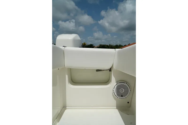 Slide: The Image of 2017 SeaVee 34Z boat interior with speaker, white seating, and blue sky background. - 75