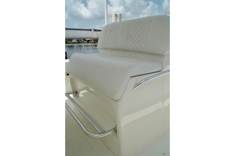 Slide: The Image of 2017 SeaVee 34Z boat seat with white upholstery and stainless steel footrest. - 88