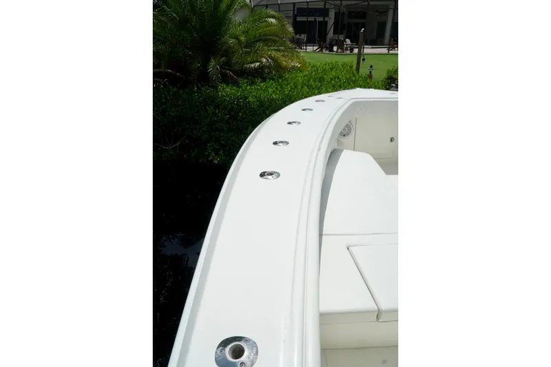 Slide: The Image of 2017 SeaVee 34Z boat deck with lush greenery in the background. - 90