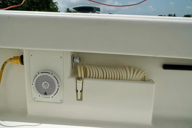 Slide: The Image of 2017 SeaVee 34Z boat deck with speaker, hose, and electrical connection. - 91