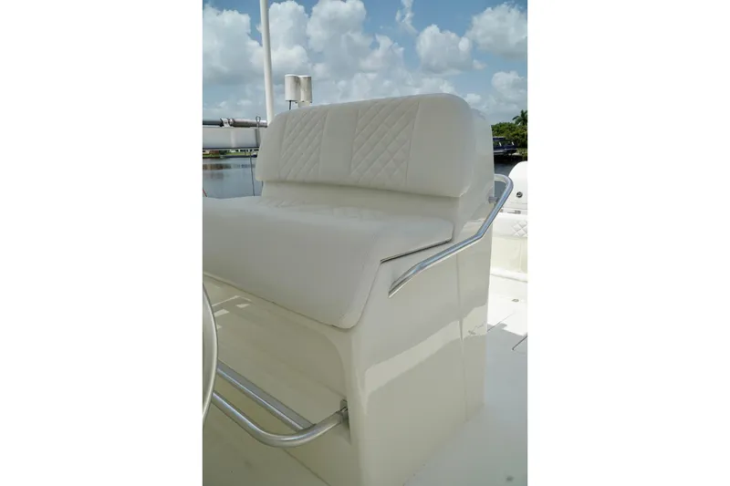 Slide: The Image of 2017 SeaVee 34Z boat with white cushioned seating and stainless steel handrails. - 93