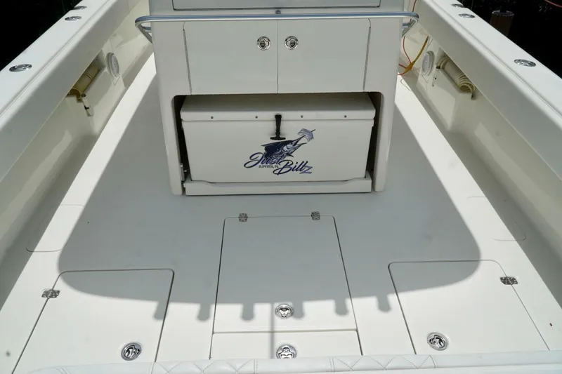 Slide: The Image of 2017 SeaVee 34Z boat deck with storage compartments and cooler. - 96