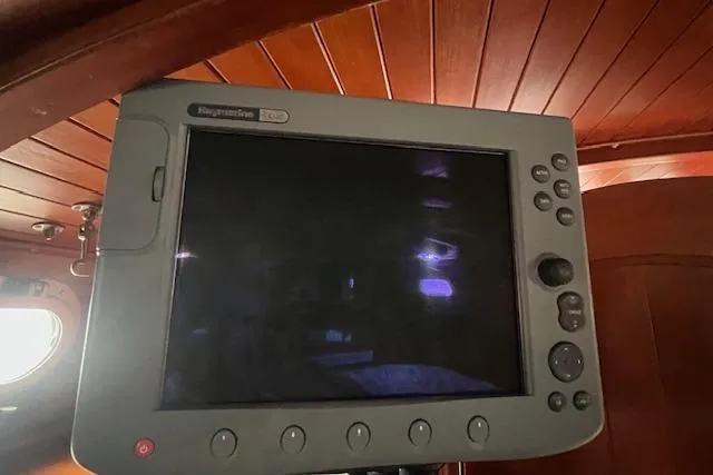 Slide: The Image of Raymarine navigation display inside 1983 Baba 40 sailboat with wooden interior. - 20