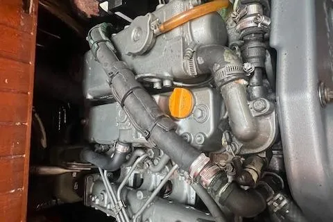 Slide: The Image of Engine of a 1983 Baba 40 sailboat, showcasing intricate mechanical components. - 24