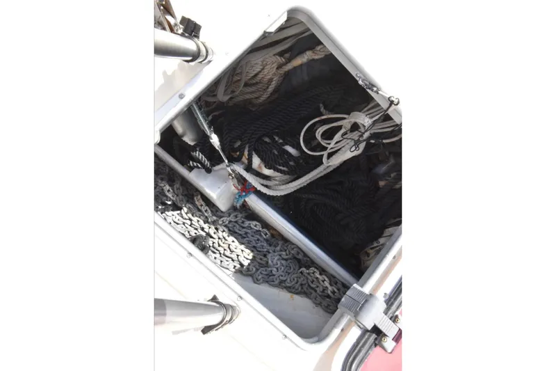 Slide: The Image of Anchor locker of 2005 Island Packet 485 sailboat with ropes and chains. - 30
