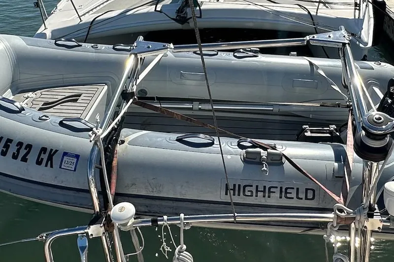 Slide: The Image of Inflatable Highfield boat secured on a 2005 Island Packet 485 yacht. - 5
