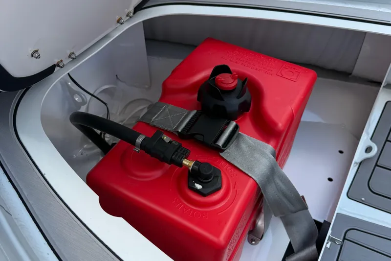 Slide: The Image of Red fuel tank in a 2025 Highfield CL310 FCT boat compartment. - 12