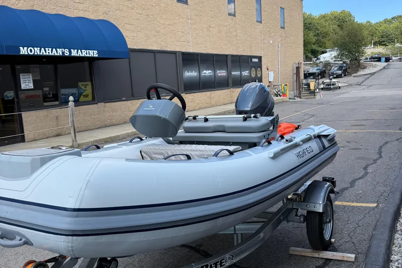Slide: The Image of 2025 Highfield CL310 FCT inflatable boat on trailer outside Monahan's Marine. - 3
