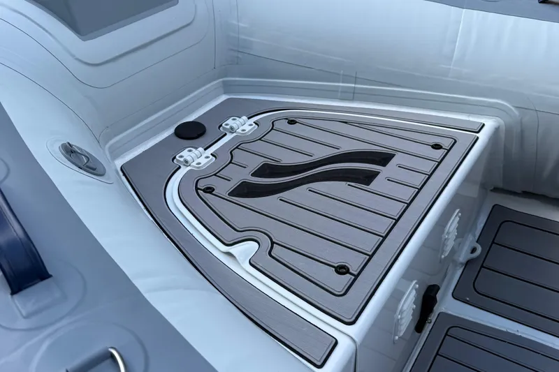 Slide: The Image of 2025 Highfield CL310 FCT boat interior with sleek, modern design and durable flooring. - 4