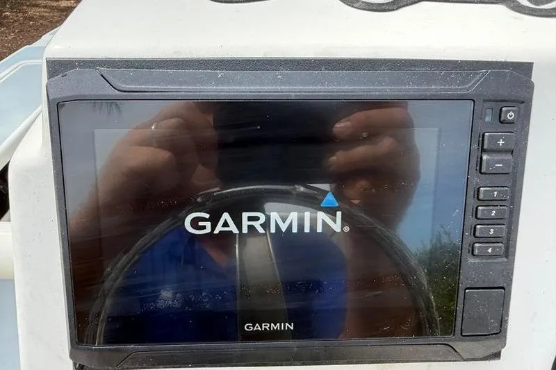 Slide: The Image of Garmin navigation system on 2013 Hewes Redfisher 18 boat dashboard. - 15