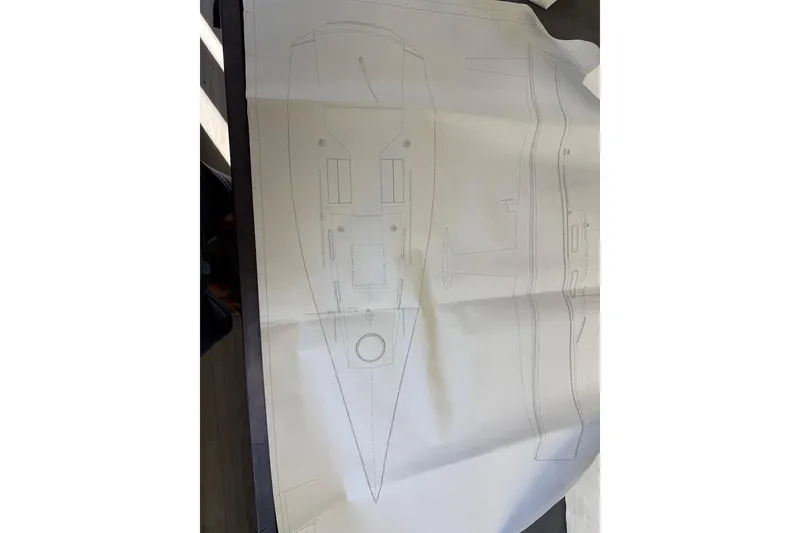 Slide: The Image of Blueprint of a 2007 Hallett 33 boat design, showcasing top and side views. - 15
