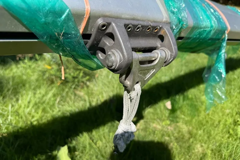 Slide: The Image of Close-up of a 2007 Hallett 33 boat component wrapped in green plastic. - 17