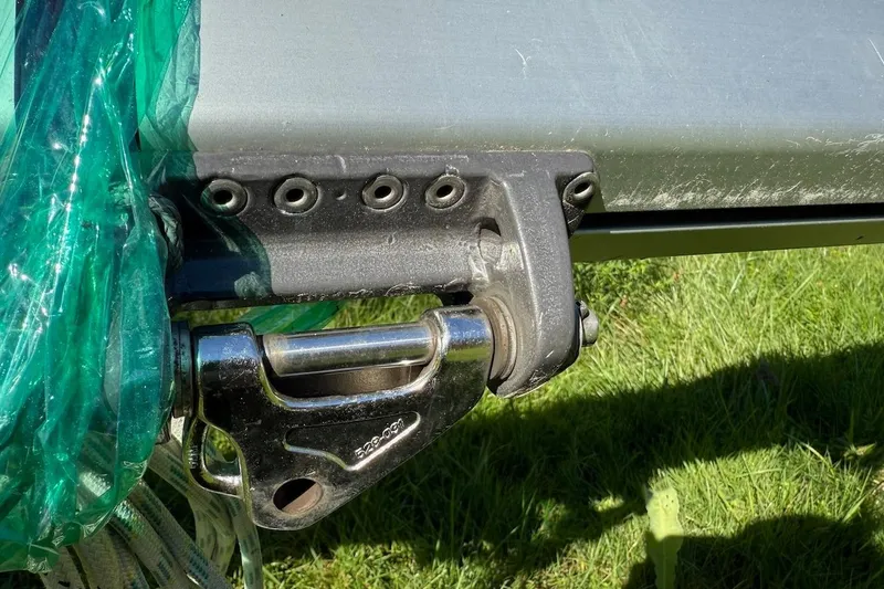 Slide: The Image of Close-up of a 2007 Hallett 33 boat component with green protective wrap. - 18
