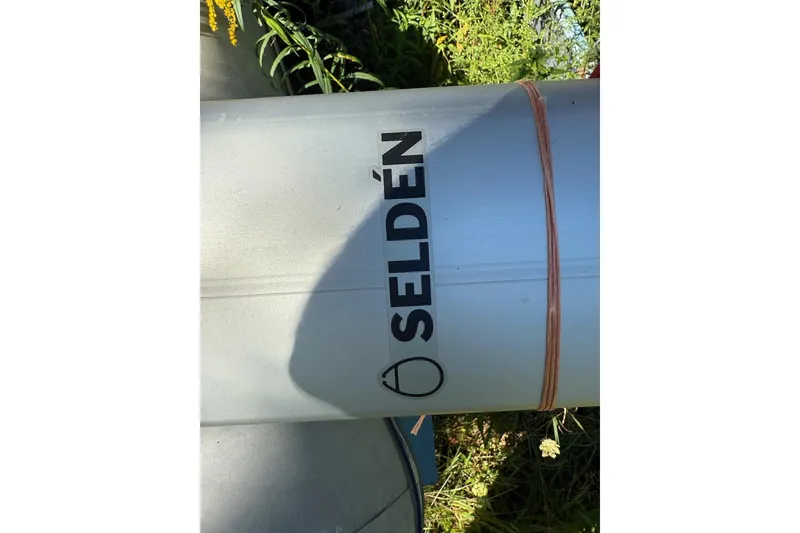 Slide: The Image of Aluminum mast with "SELDÉN" branding, surrounded by greenery. - 22