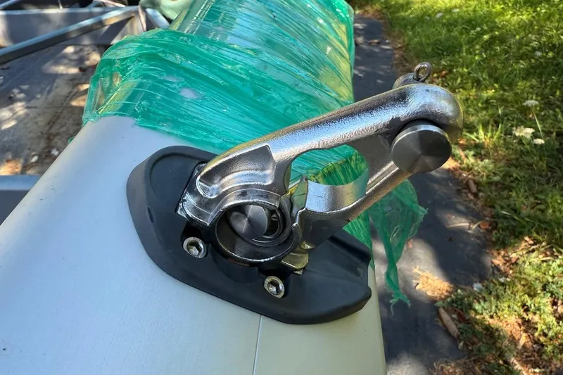 Slide: The Image of Close-up of a 2007 Hallett 33 boat component wrapped in green plastic. - 25