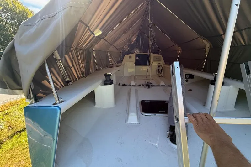 Slide: The Image of Covered 2007 Hallett 33 boat interior with visible deck and equipment. - 31