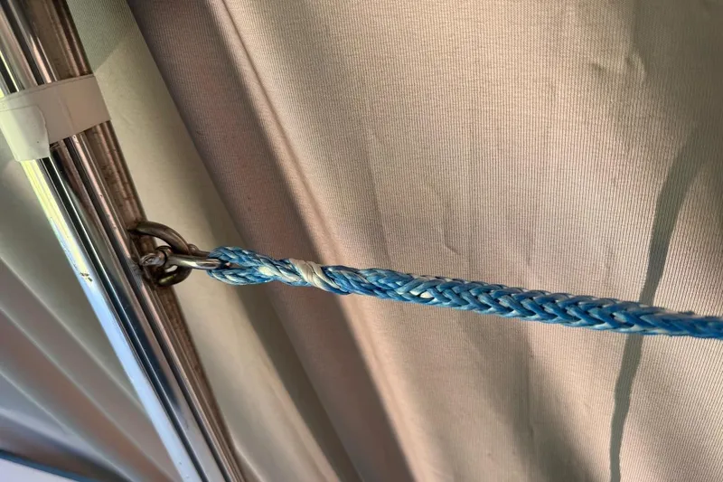 Slide: The Image of Close-up of a blue braided rope attached to a metal ring on a Hallett 33, 2007. - 34