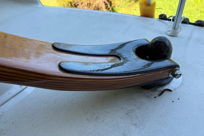 Slide: The Image of Close-up of a Hallett 33 boat component, showcasing wood and metal details, 2007 model. - 37