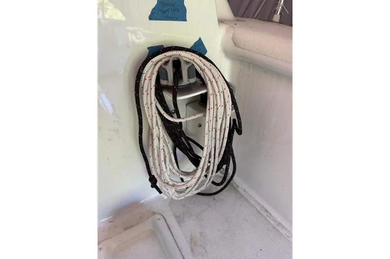 Slide: The Image of Coiled rope on a 2007 Hallett 33 boat, secured on a white interior surface. - 39
