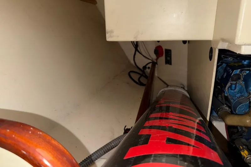 Slide: The Image of Interior view of a 2007 Hallett 33 boat engine compartment with visible components. - 42