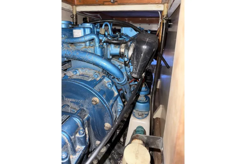 Slide: The Image of 2007 Hallett 33 engine compartment with blue mechanical components and wiring. - 45