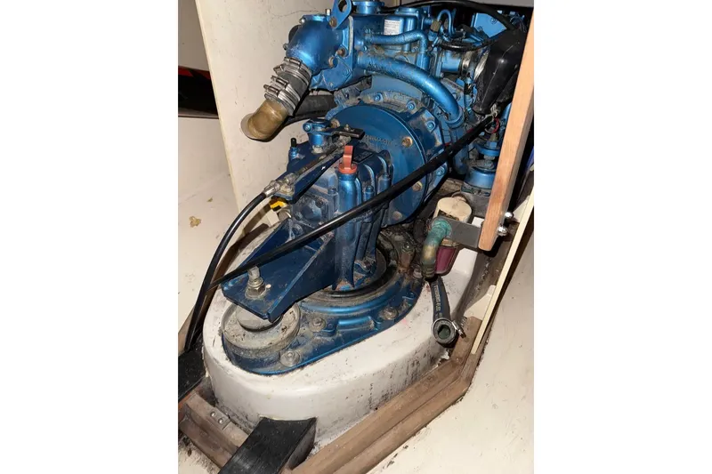 Slide: The Image of Engine compartment of a 2007 Hallett 33 boat, featuring a blue marine engine. - 46