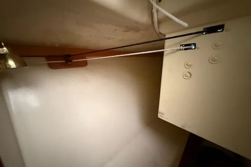 Slide: The Image of Interior view of a 2007 Hallett 33 boat showing a secured rope mechanism. - 49