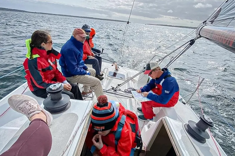 Slide: The Image of People sailing on a 2007 Hallett 33 boat, enjoying a sunny day on the water. - 5