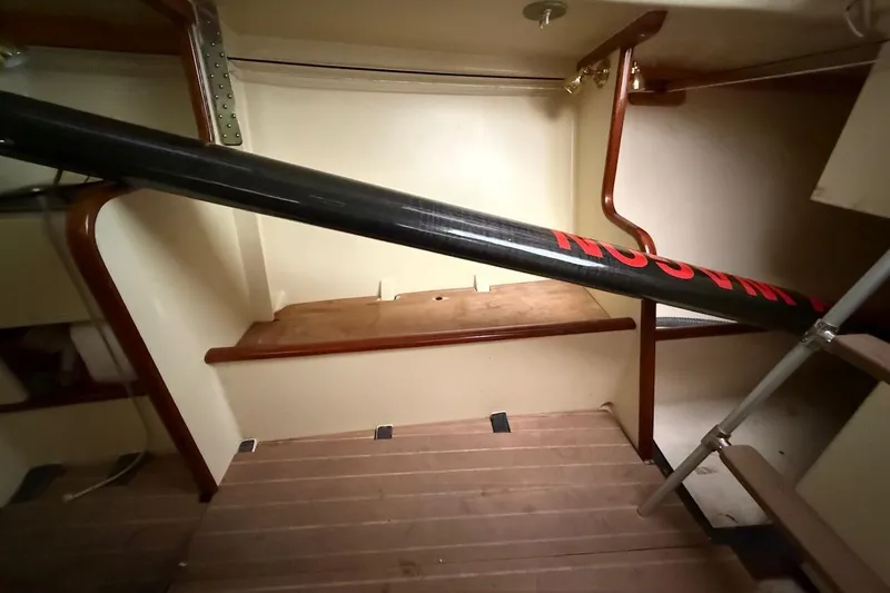 Slide: The Image of Interior of a 2007 Hallett 33 boat with wooden accents and a black pole. - 51