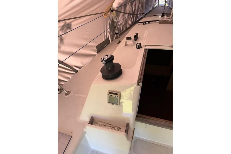 Slide: The Image of 2007 Hallett 33 boat deck with winch and control panel under canopy. - 59