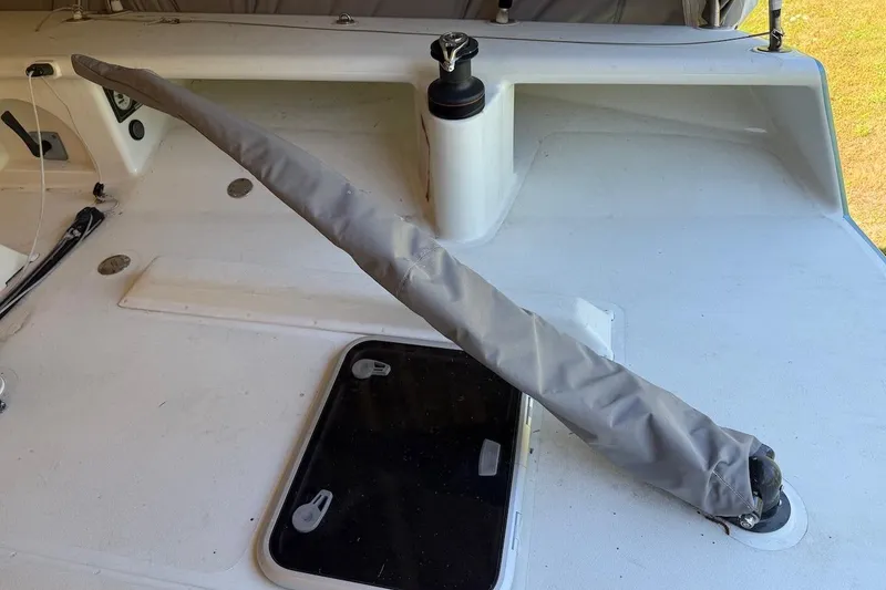 Slide: The Image of 2007 Hallett 33 boat deck with covered equipment and hatch. - 63