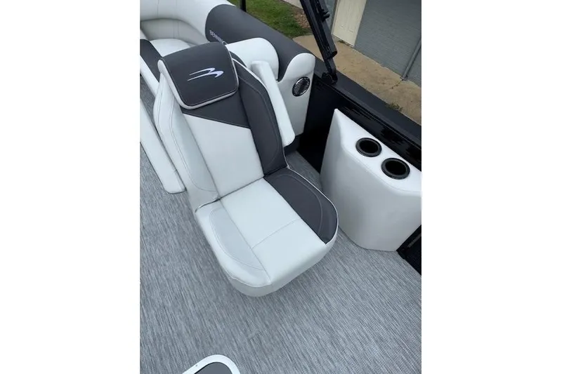 Slide: The Image of 2026 Bennington 22 SSR boat seat with gray and white upholstery, featuring cup holders. - 11