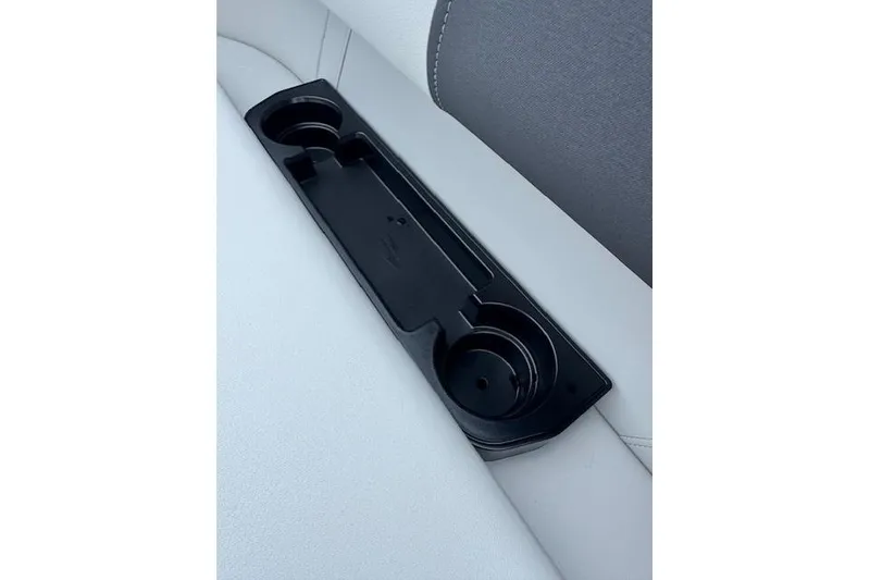 Slide: The Image of Cup holder on 2026 Bennington 22 SSR boat seat, featuring sleek black design. - 13