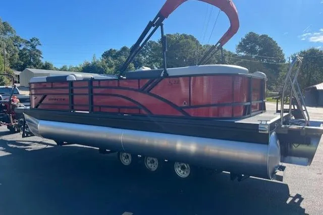 Slide: The Image of 2026 Bennington 22 SSR pontoon boat with red exterior on a trailer. - 2