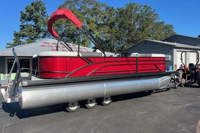 Slide: The Image of 2026 Bennington 22 SSR pontoon boat with red canopy on a trailer. - 3