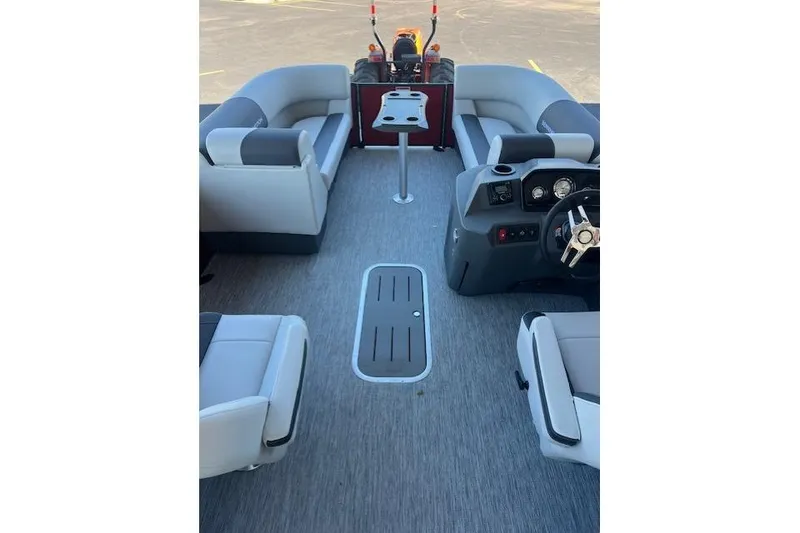 Slide: The Image of 2026 Bennington 22 SSR pontoon boat interior with seating and steering console. - 4