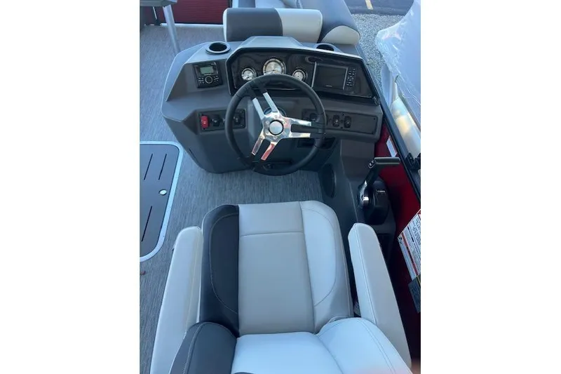 Slide: The Image of 2026 Bennington 22 SSR boat dashboard with steering wheel and controls. - 5