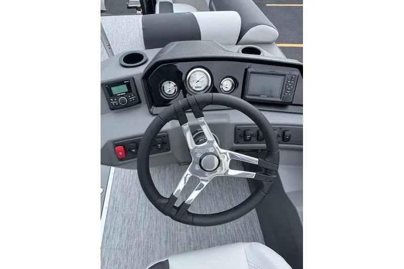 Slide: The Image of Steering console of 2026 Bennington 22 SSR boat with modern controls and gauges. - 8