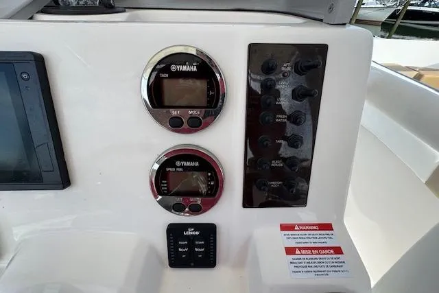 Slide: The Image of Control panel of 2018 Robalo R222 Explorer boat with Yamaha gauges and switches. - 10