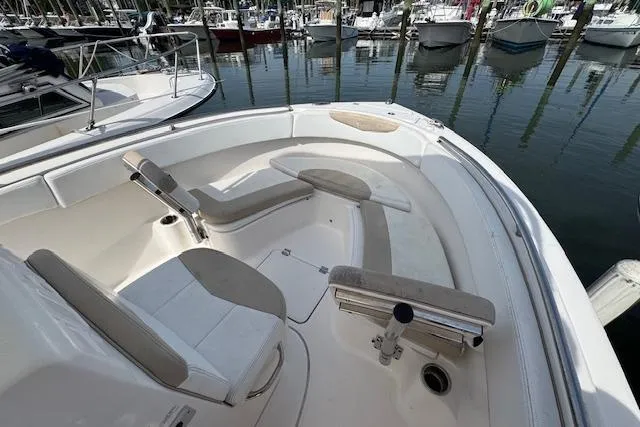 Slide: The Image of 2018 Robalo R222 Explorer boat interior with seating, docked at marina. - 16