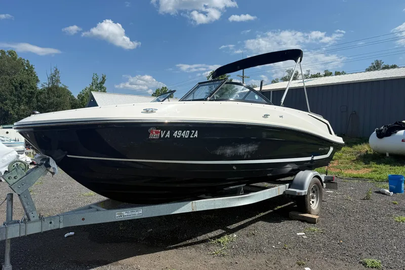 The Image of 2019 Bayliner VR5 Bowrider I/O on trailer under blue sky. - 0