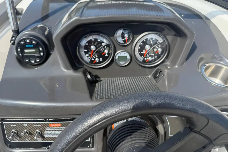 Slide: The Image of Dashboard of 2019 Bayliner VR5 Bowrider I/O with gauges and controls. - 5